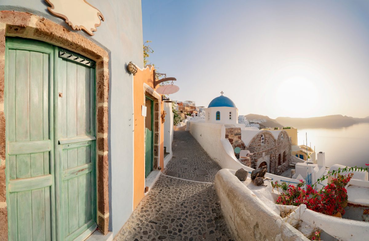 Iconic blue dome church overlooking Santorini, Greece
